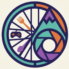 Logo: a bicycle wheel with a fork, a spoon and a game controller, a mountain and a camera lens